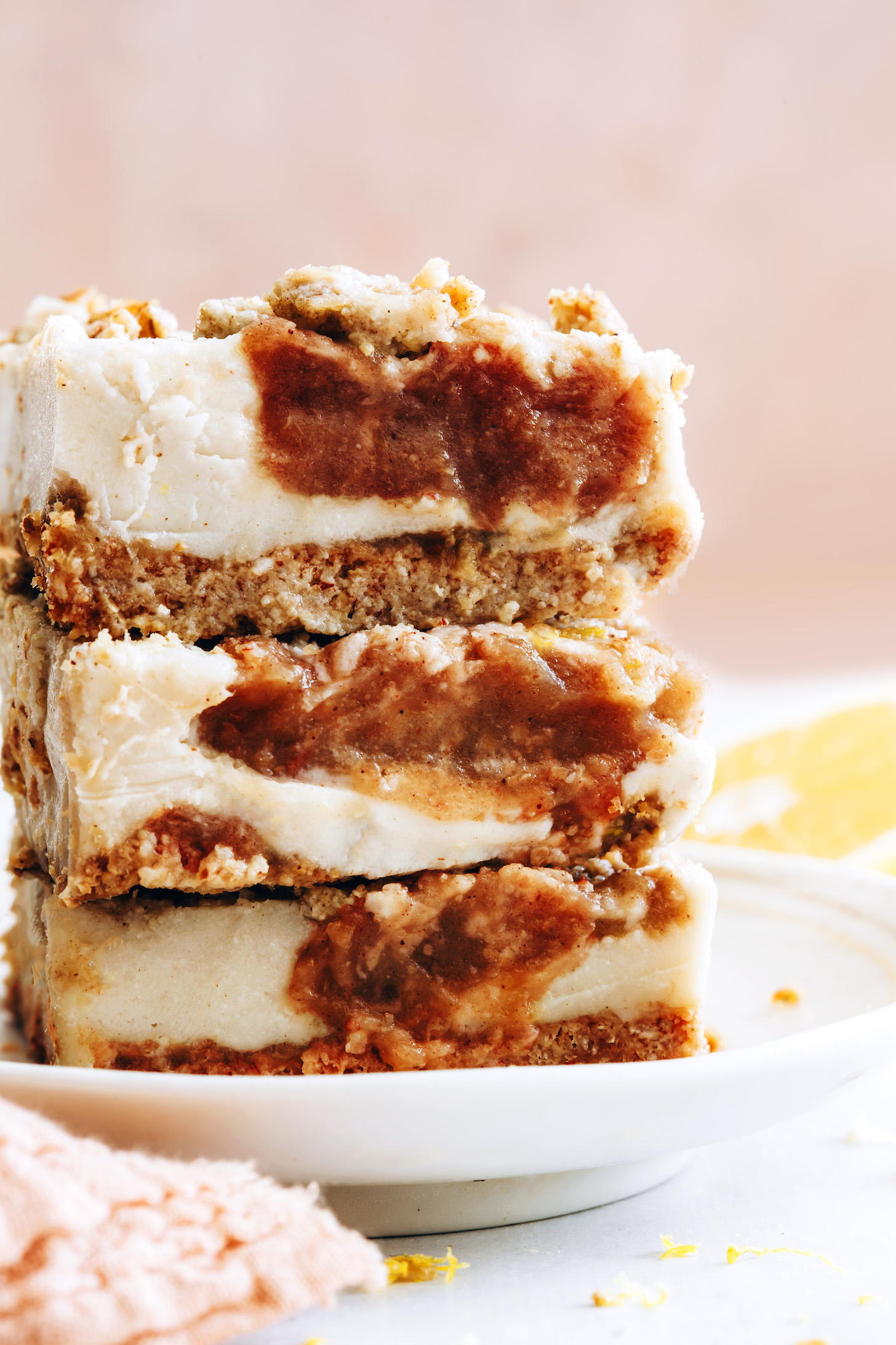 Close up shot of a stack of vegan cheesecake bars filled with apple butter