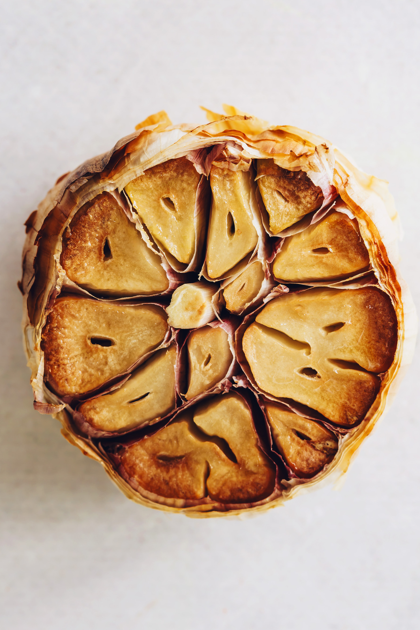 Close up shot of a head of roasted garlic