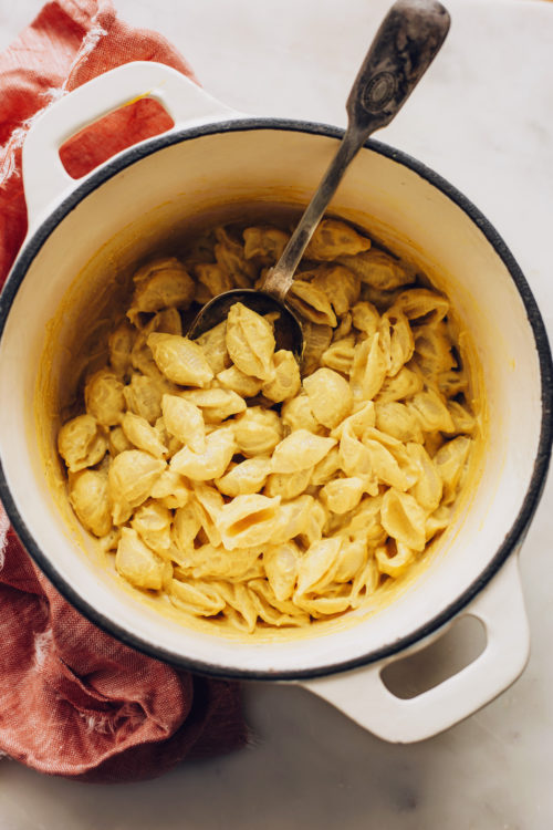 Dutch oven filled with creamy vegan mac and cheese