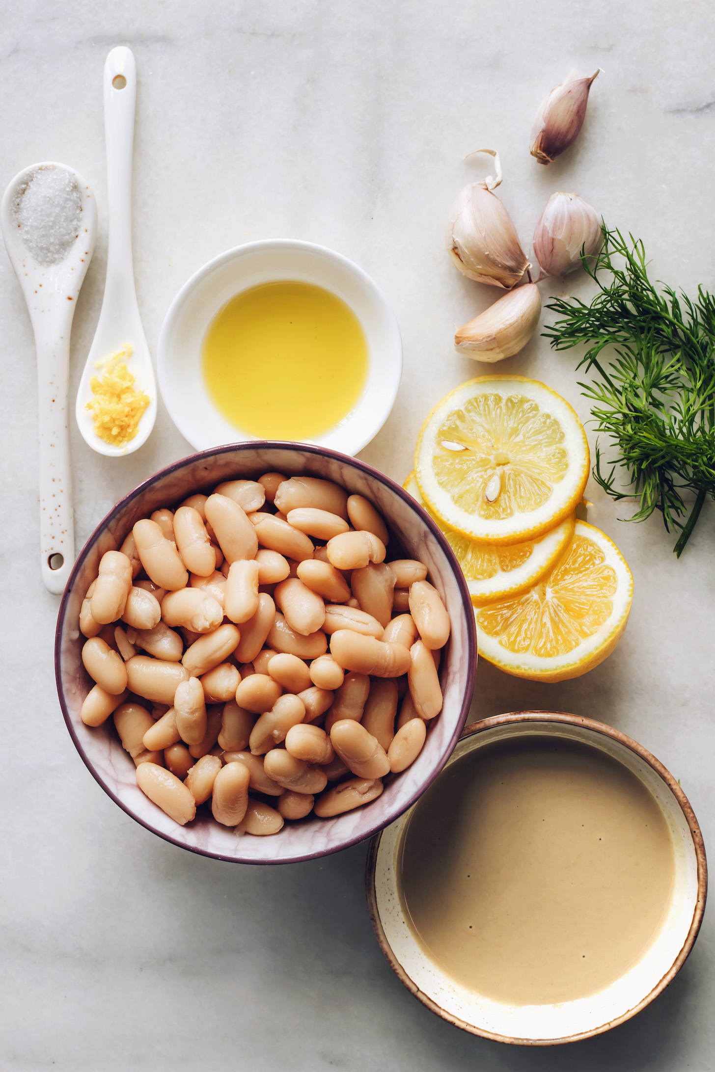 Sea salt, lemon, white beans, tahini, olive oil, garlic, and dill