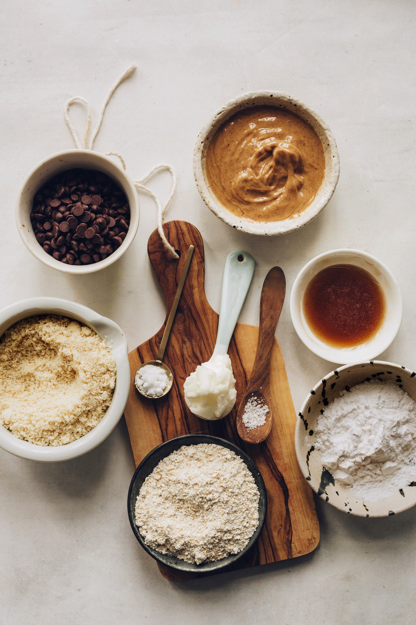Chocolate chips, peanut butter, maple syrup, tapioca flour, oat flour, almond flour, coconut oil, baking soda, and sea salt