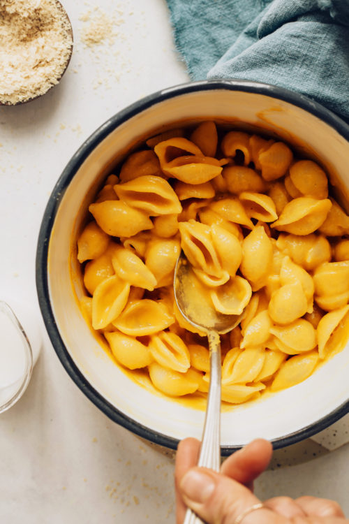 Spoon in a pot of vegan mac and cheese