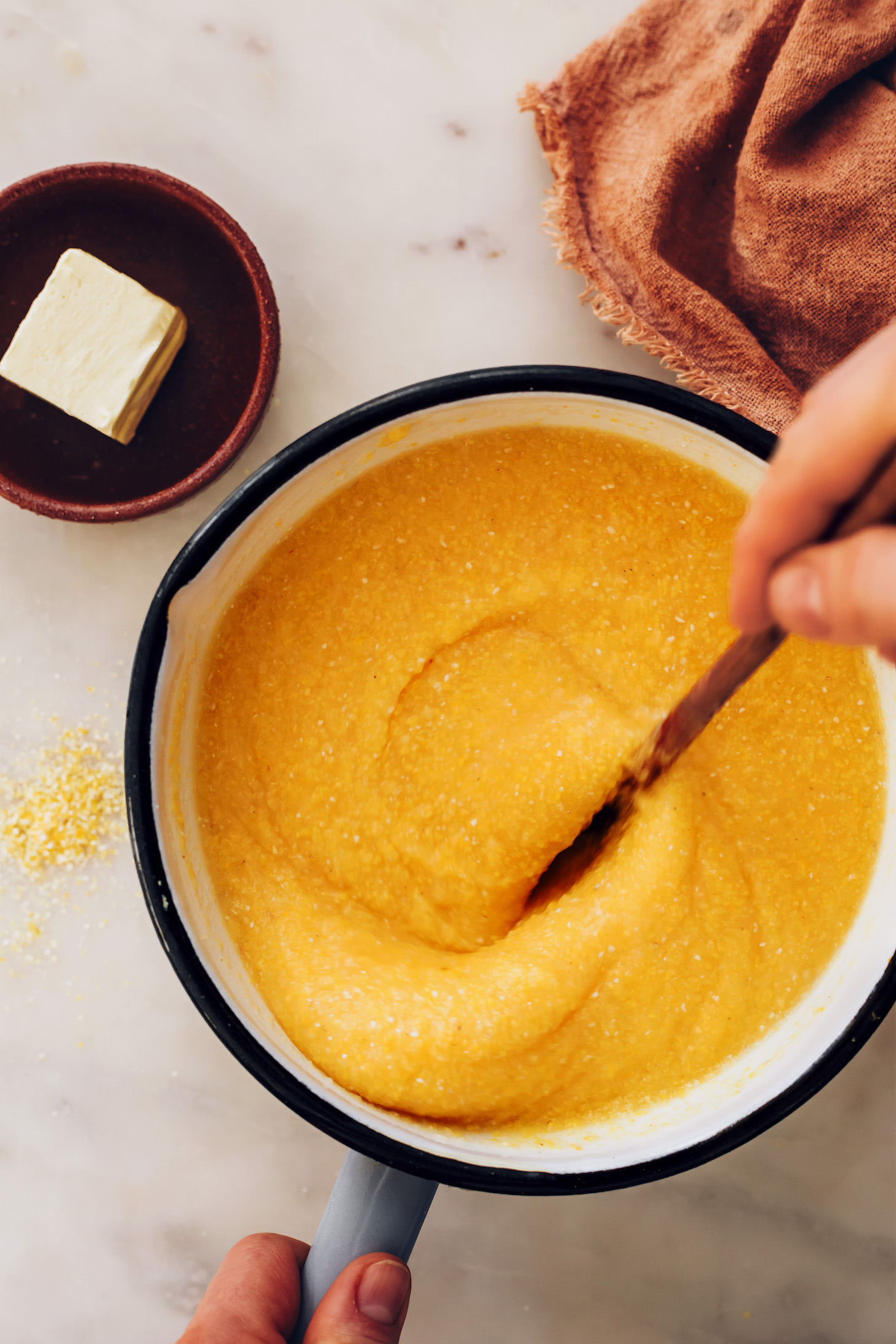 Stirring a pot of polenta