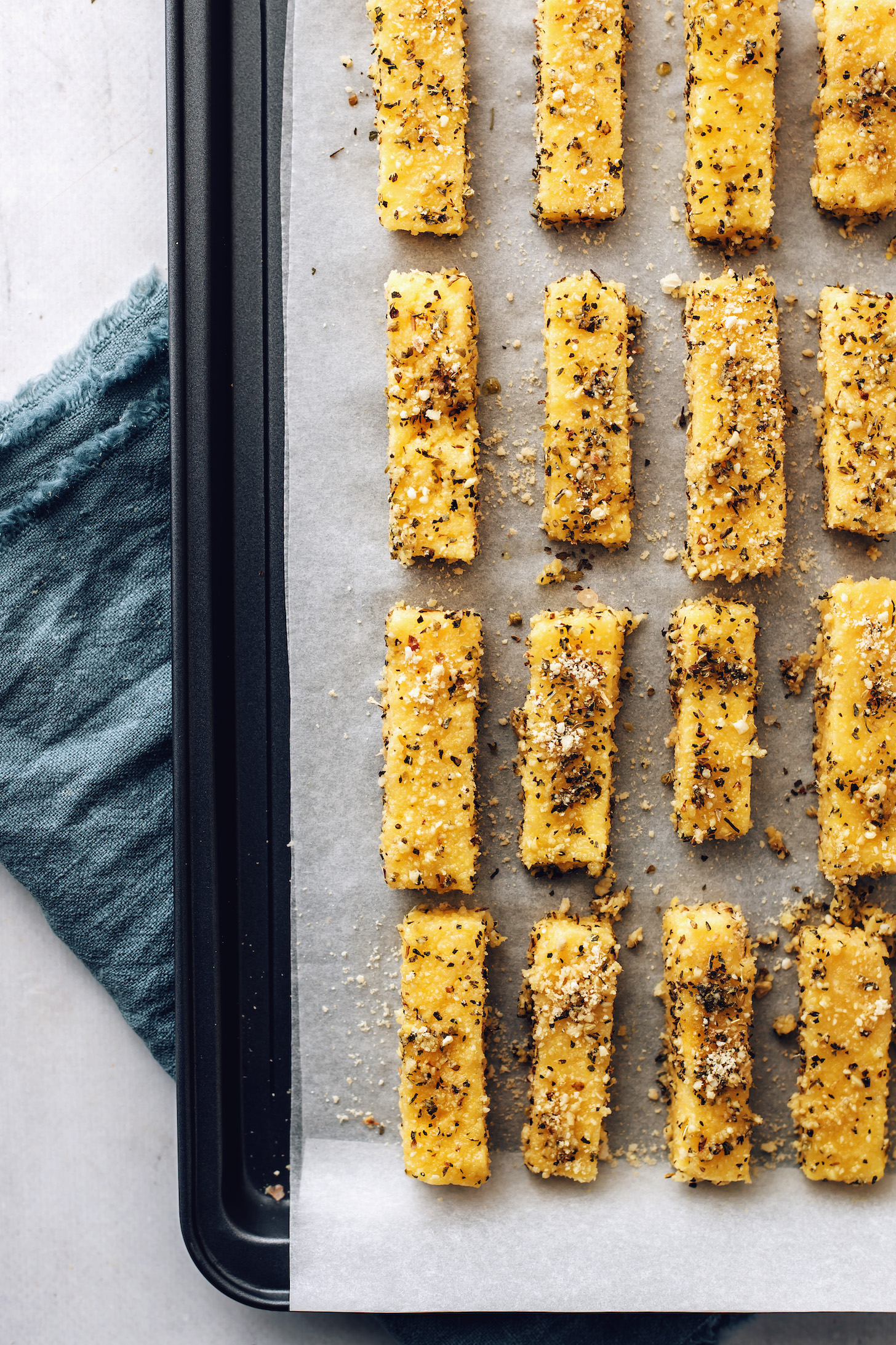 Baking sheet of polenta fries ready to go in the oven