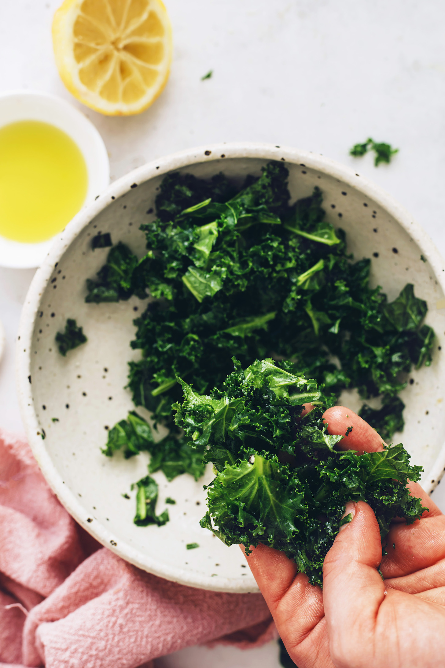 Bowl and handful of massaged kale