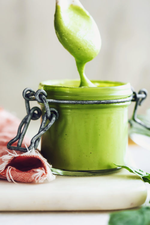 Spoon and jar of green goddess dressing