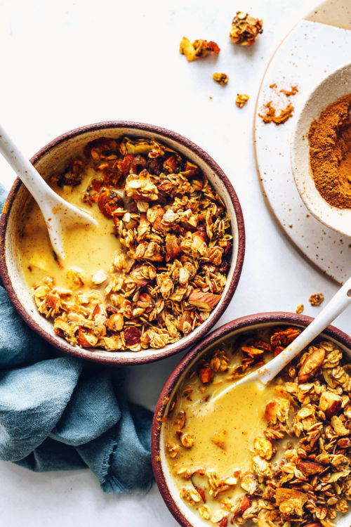 Bowls of golden milk granola with dairy-free milk