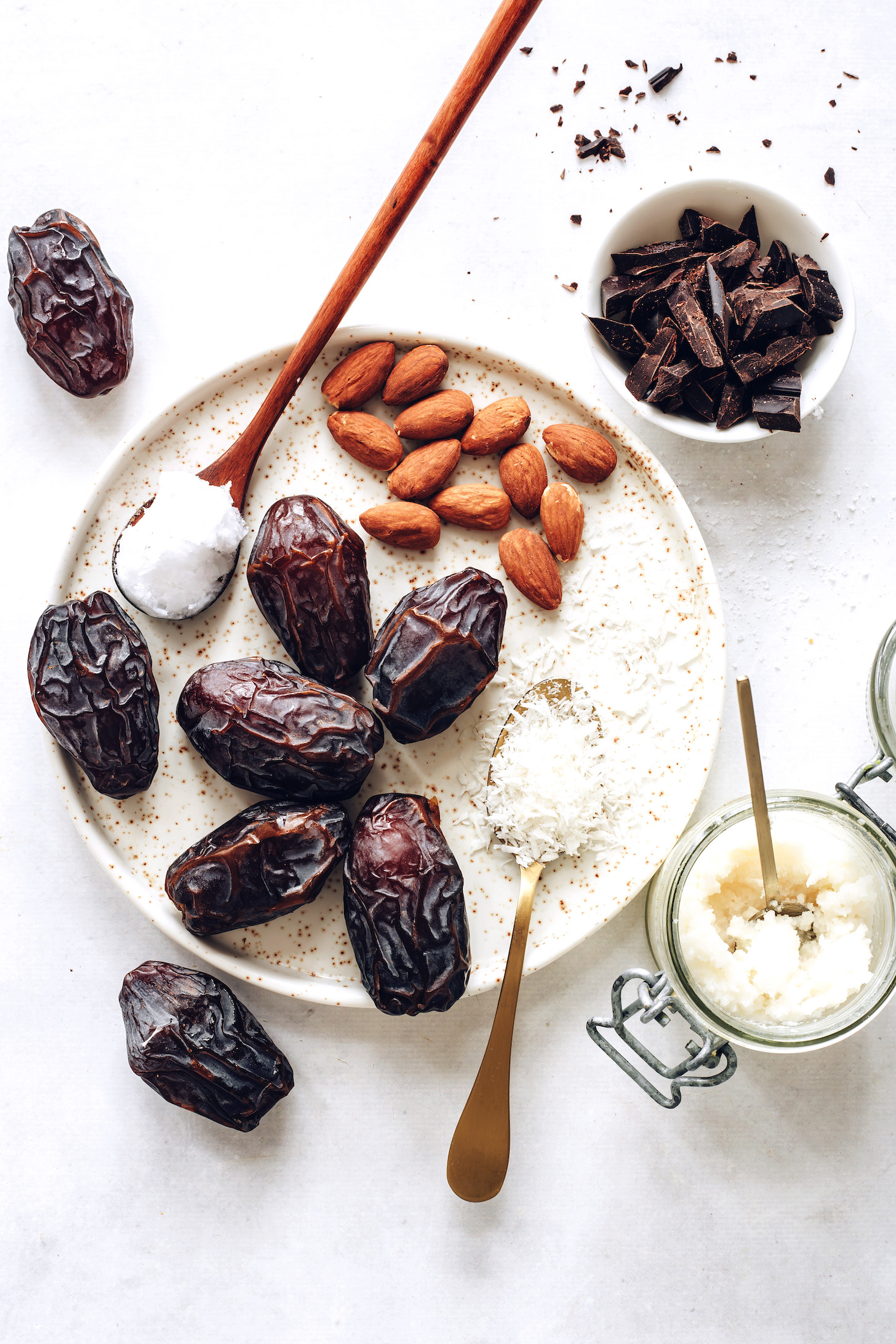 Medjool dates, coconut butter, desiccated coconut, almonds, coconut oil, and dark chocolate