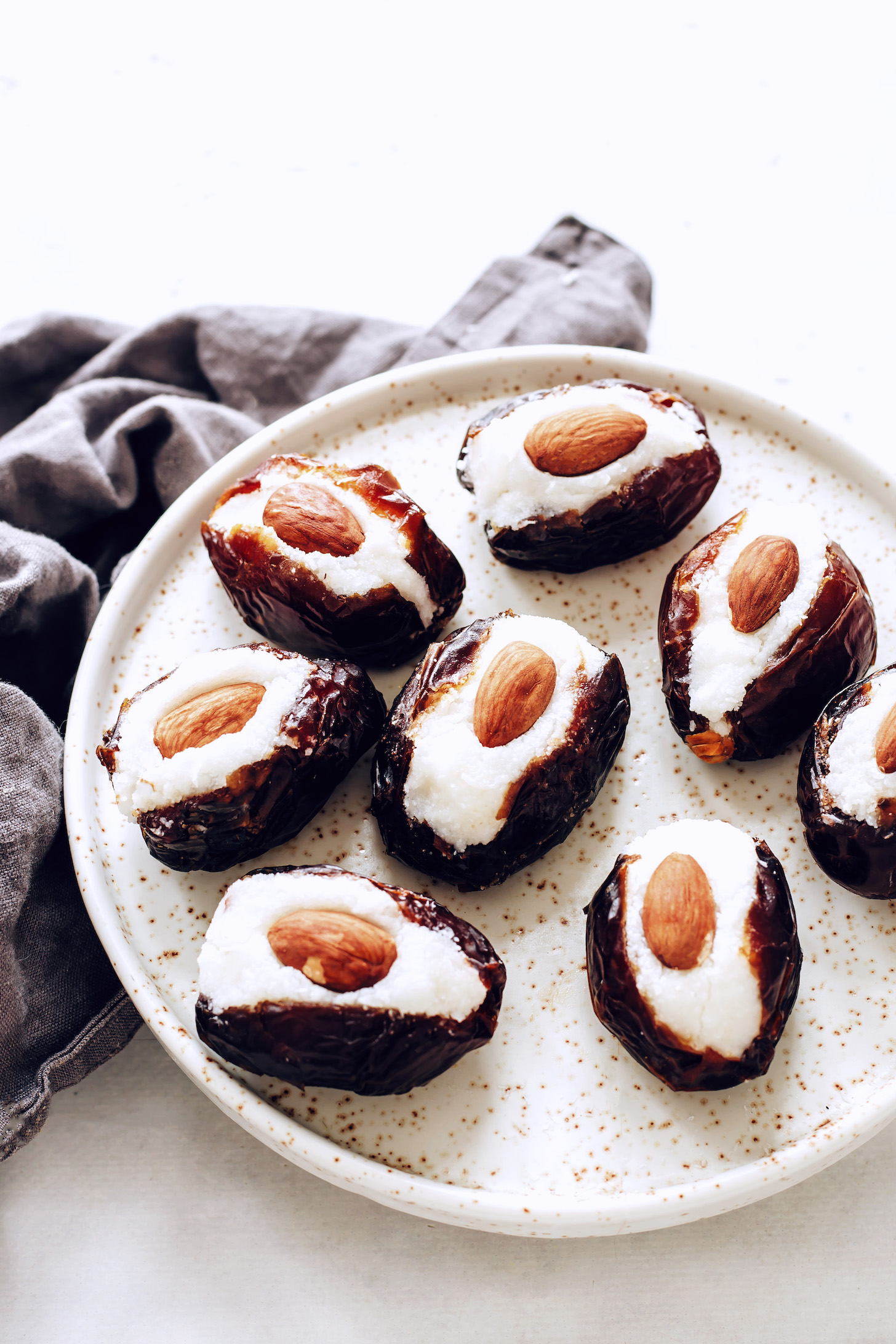 Plate of medjool dates stuffed with coconut butter and almonds