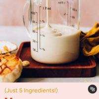 Pouring vegan bechamel sauce into a measuring glass