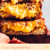 Stack of three vegan grilled cheese sandwiches