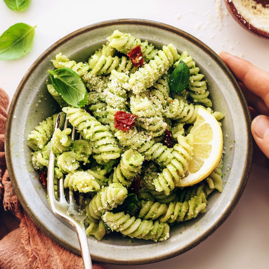 Vintage fork in a bowl of our avocado pesto pasta salad recipe