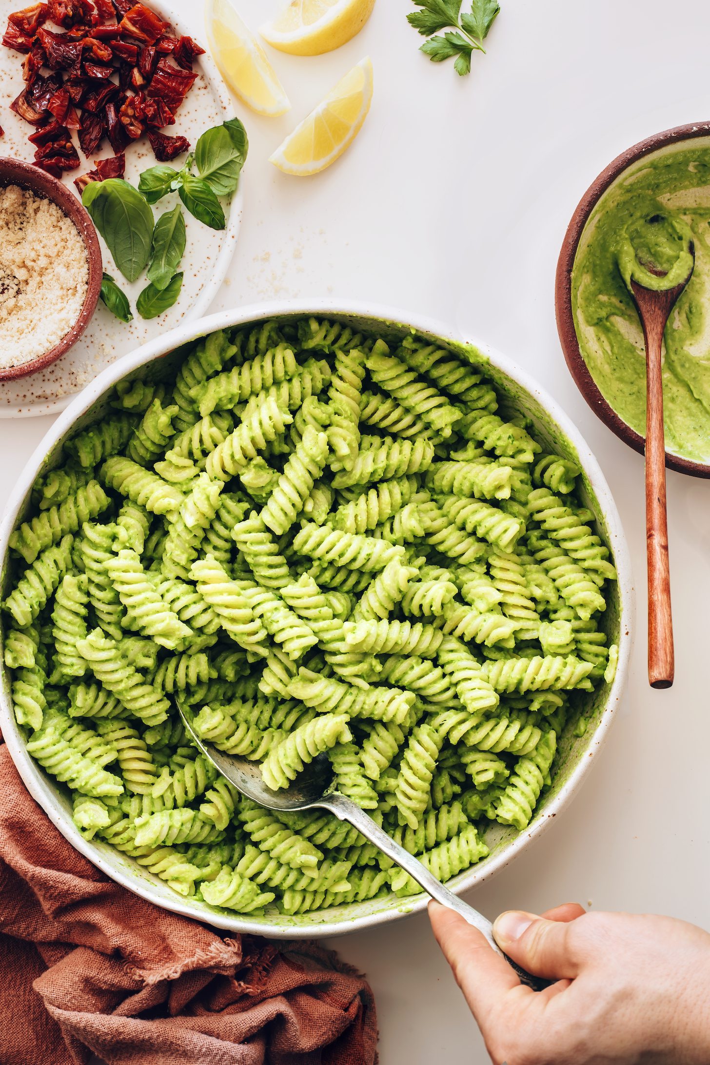 Large serving bowl of avocado pesto on gluten-free noodles