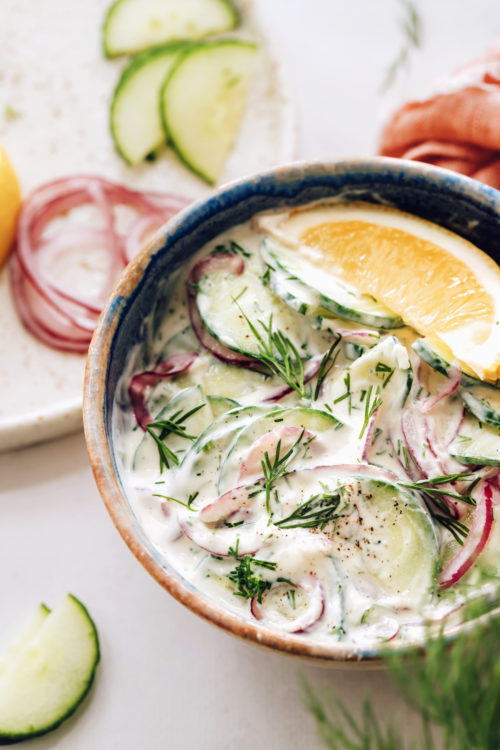 Bowl of our creamy cucumber salad with fresh dill