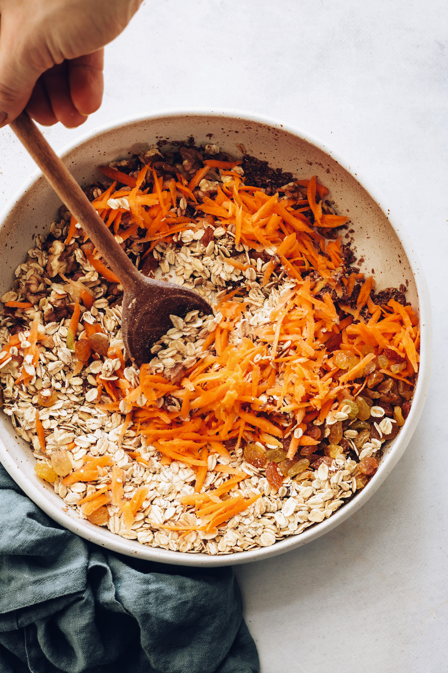 Stirring together ingredients for carrot cake baked oatmeal
