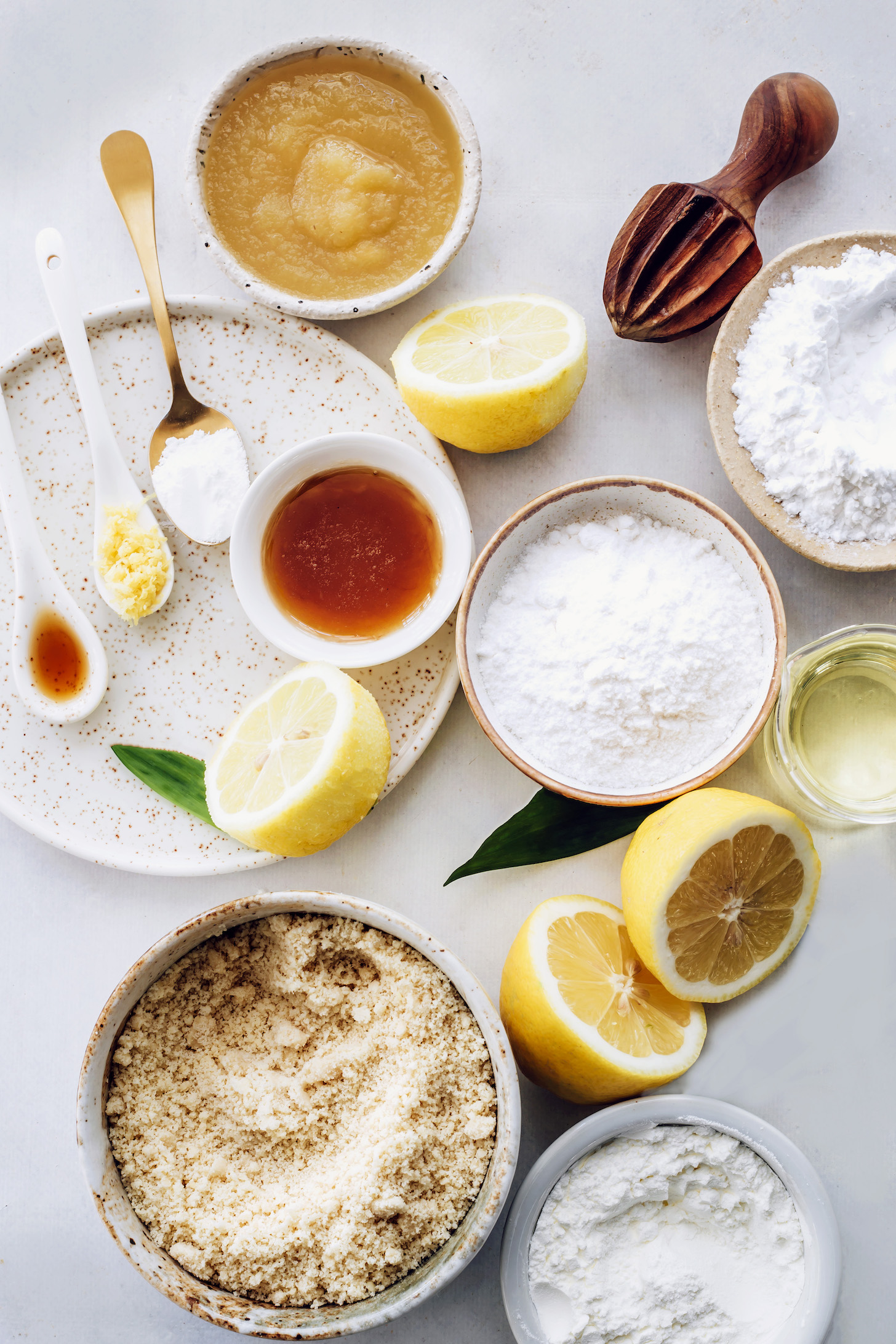 Gluten-free flours, applesauce, lemons, maple syrup, avocado oil, vanilla, and baking powder