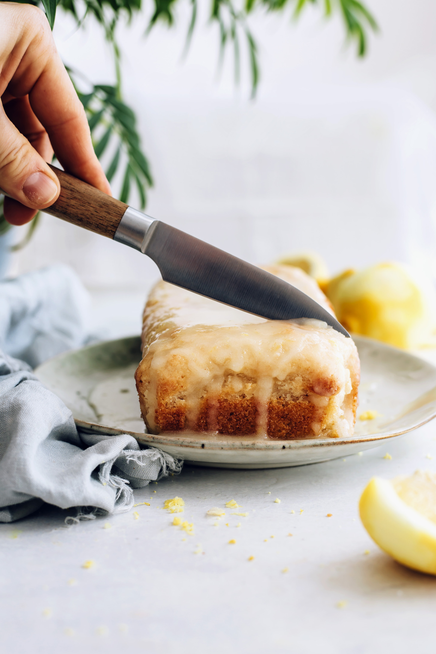 Slicing into a gluten-free lemon loaf cake