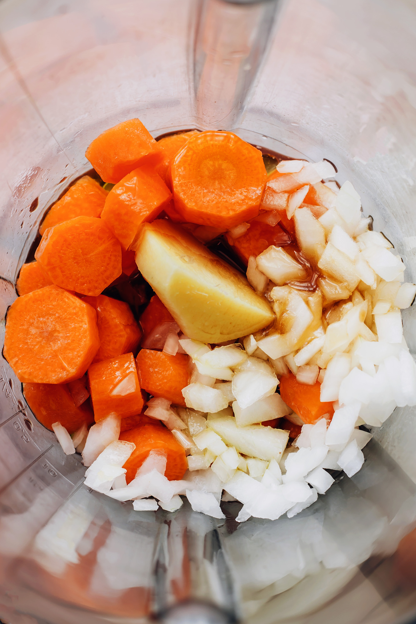 Blender with ingredients for making our carrot ginger dressing recipe