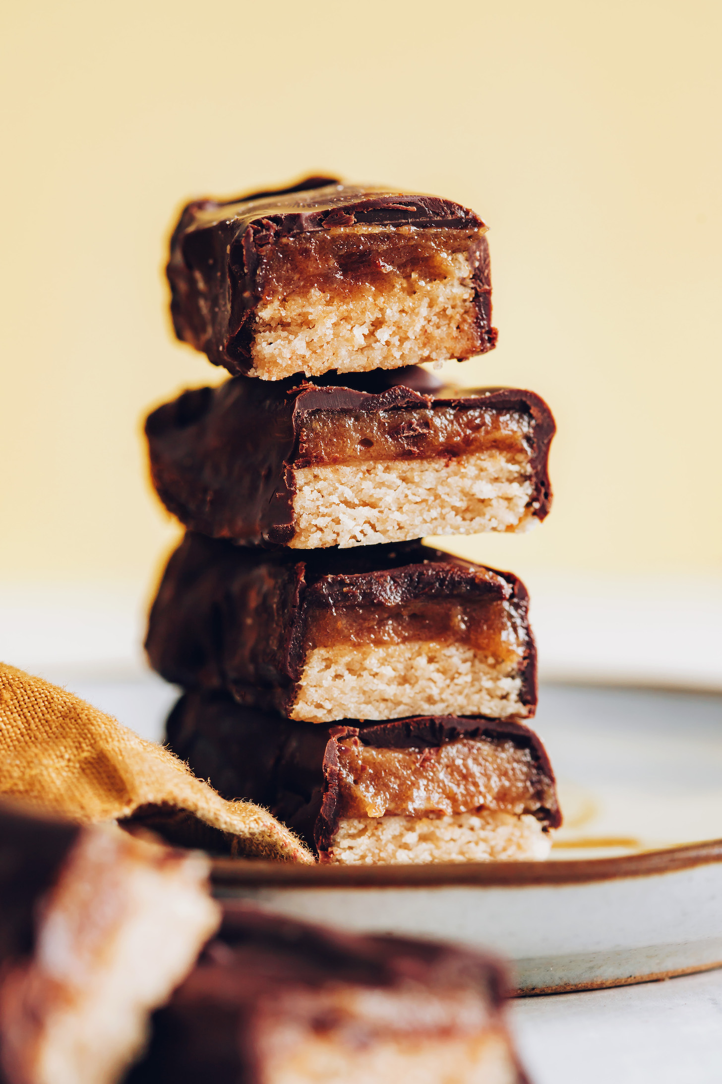 Stack of four homemade gluten-free vegan Twix bars