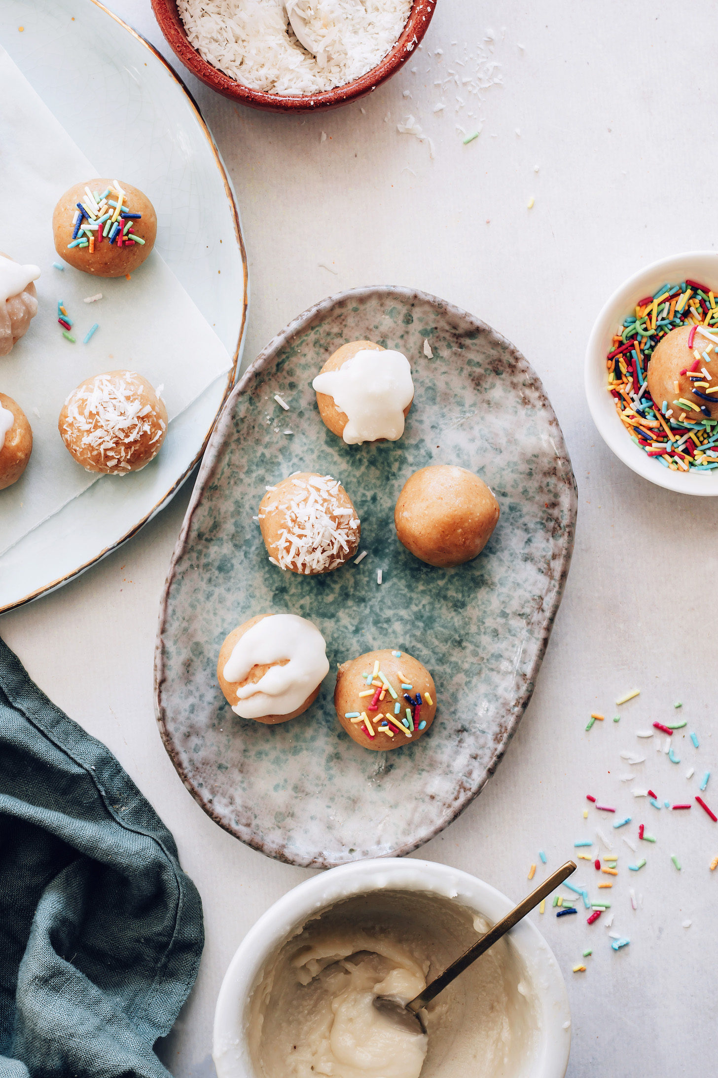 No-bake sugar cookie bites topped with sprinkles, shredded coconut, or glaze