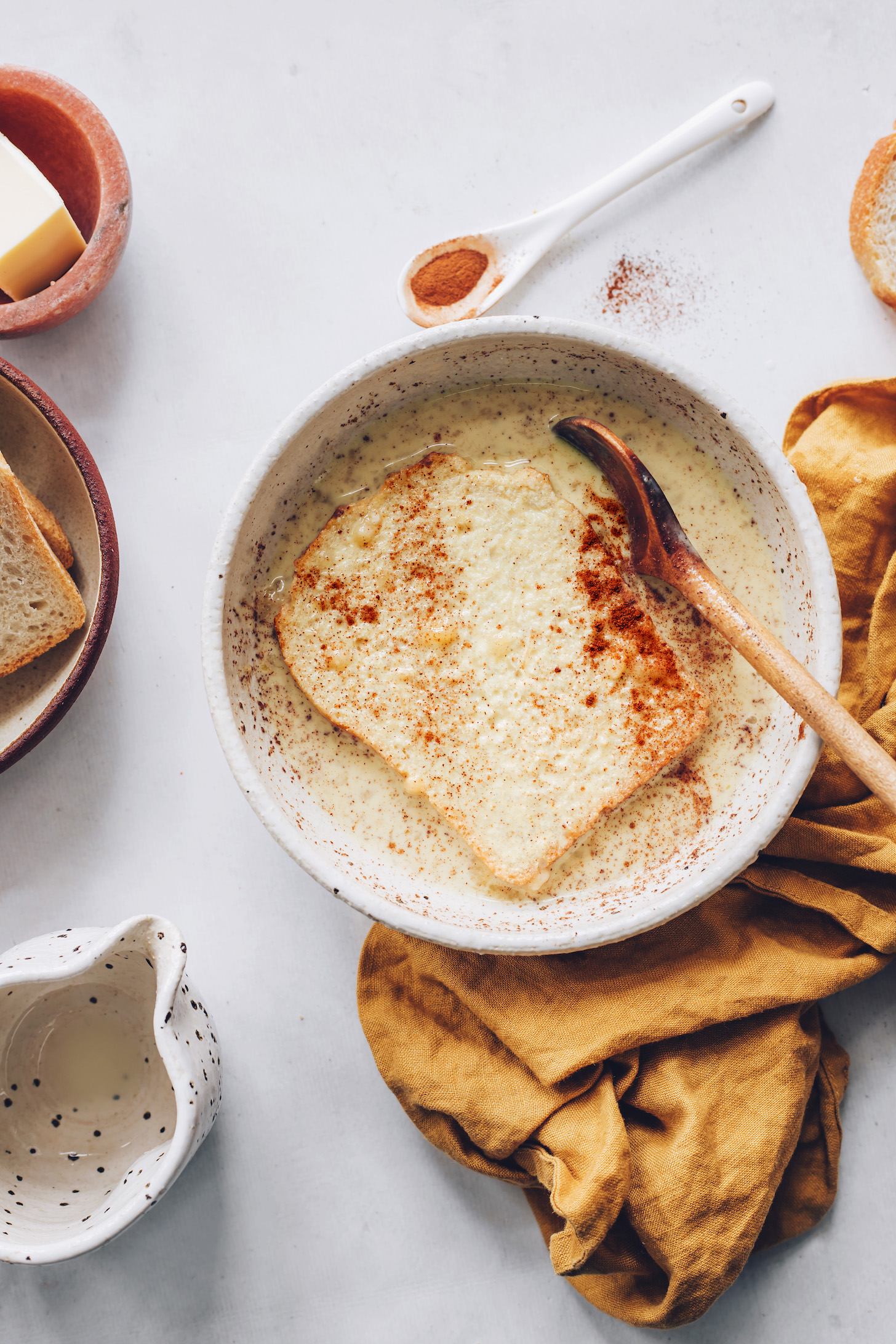 Slice of sourdough bread in vegan French toast batter