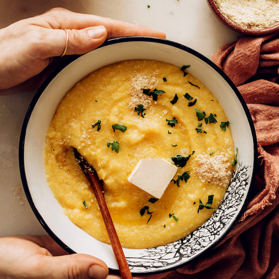 Holding the sides of a bowl of vegan polenta