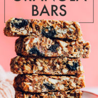 Cherry almond granola bars piled high on a plate