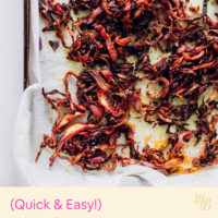 Parchment-lined baking sheet of roasted cabbage