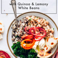 Spring Buddha bowl with quinoa, veggies, hummus, and gluten-free flatbread