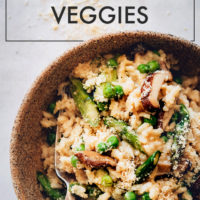 Big bowl of vegan risotto with miso, asparagus, and mushrooms