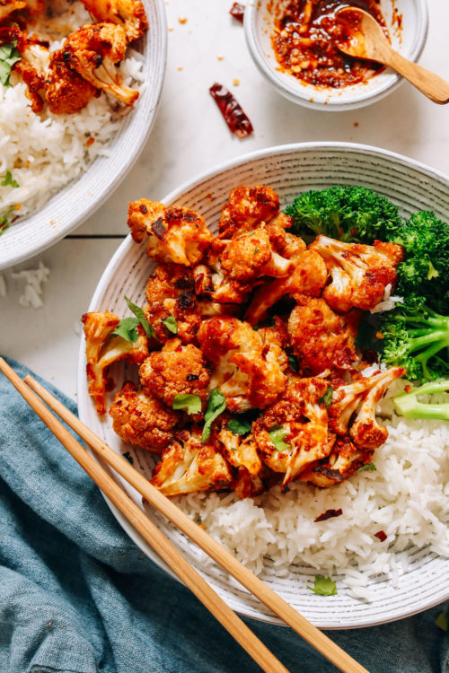 Bowl of General Tso Cauliflower with steamed broccoli and rice