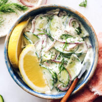 Top down shot of a bowl of creamy cucumber salad