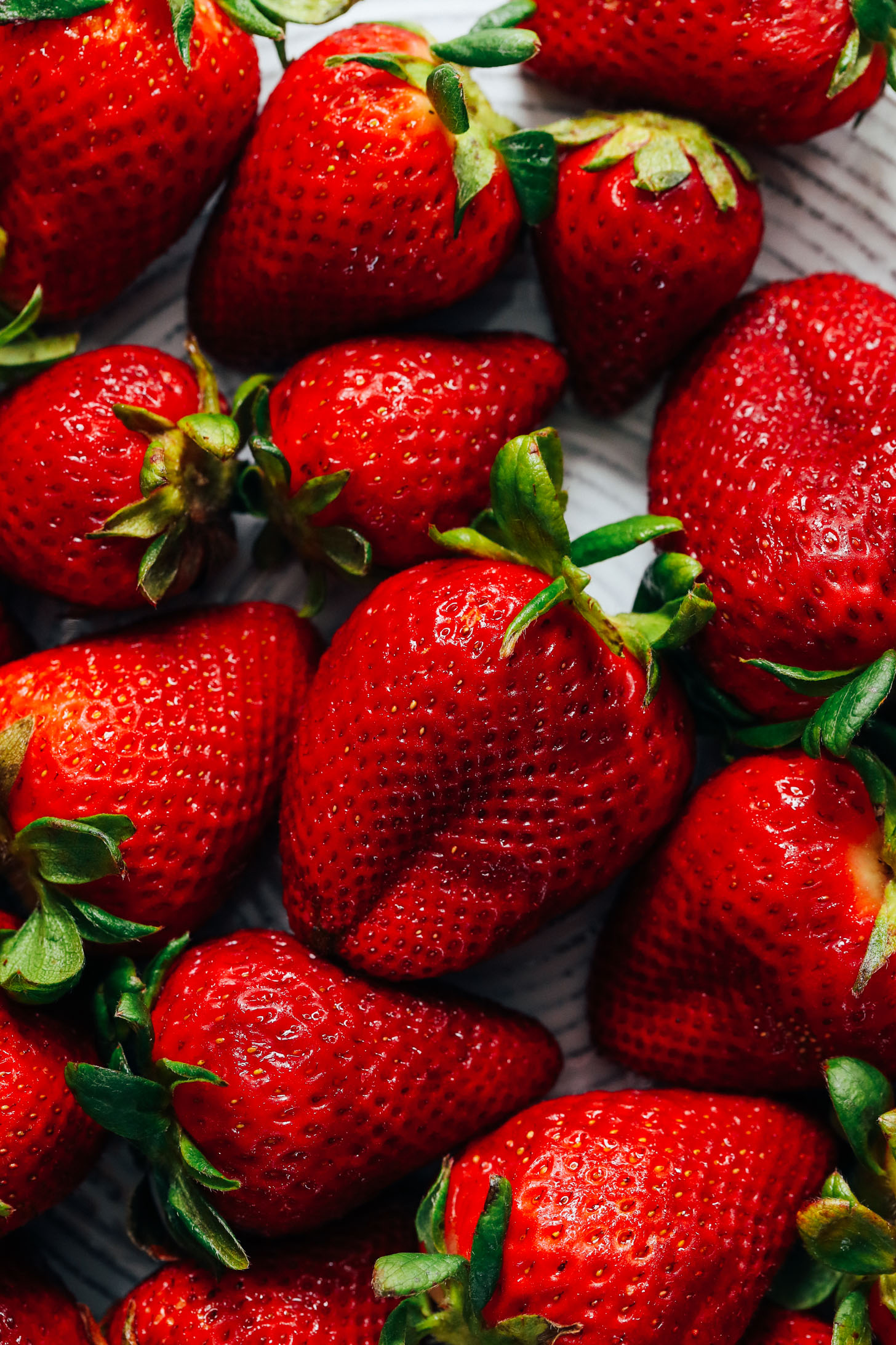Close up shot of a plate of fresh strawberries
