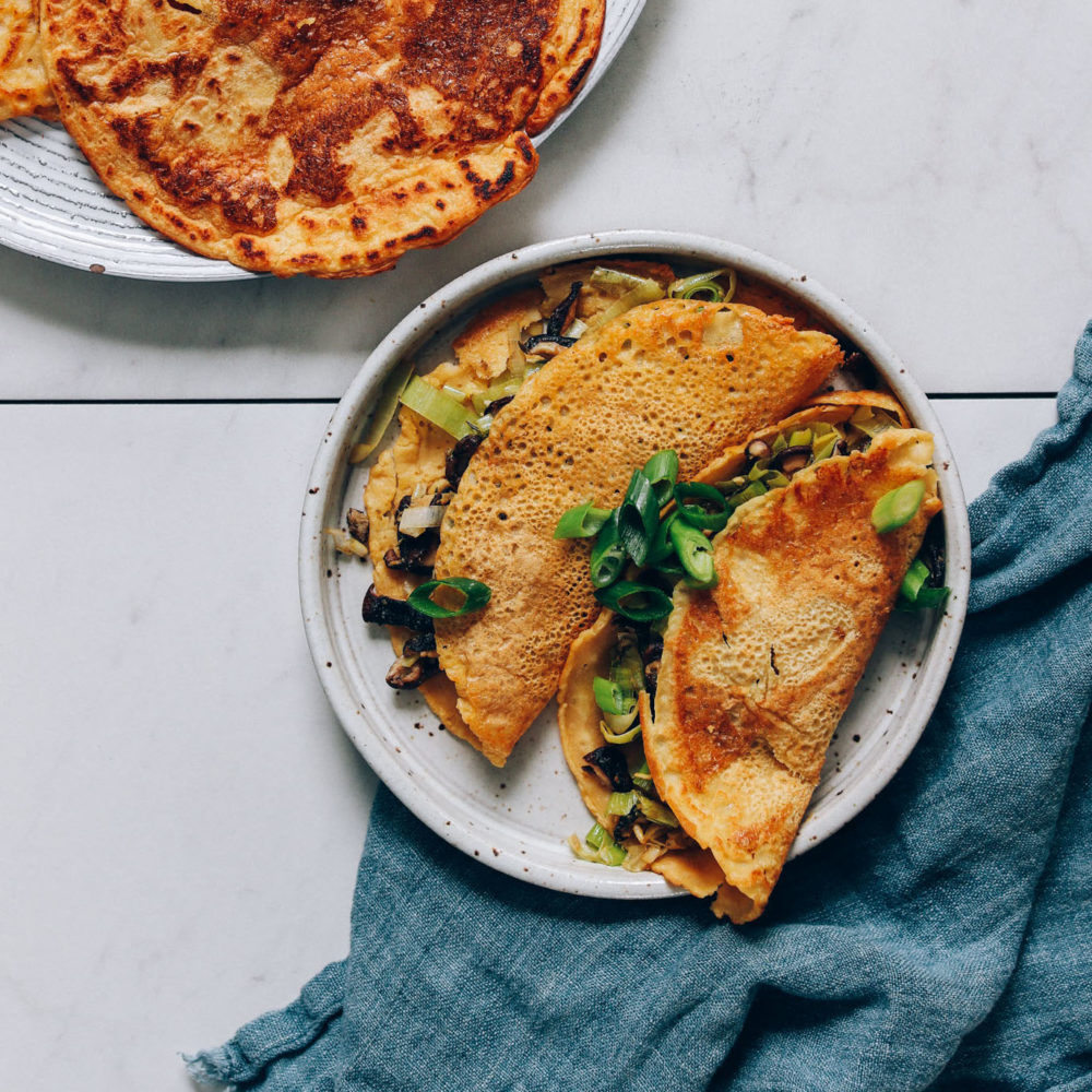 Plates of savory chickpea pancakes