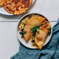 Plates of savory chickpea pancakes