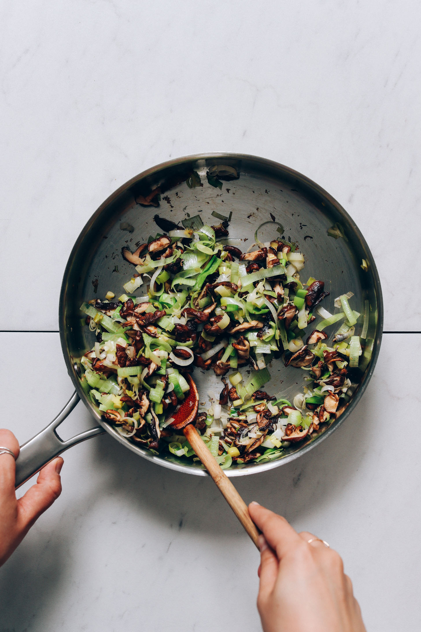 Sautéed mushrooms and leeks in a rimmed skillet