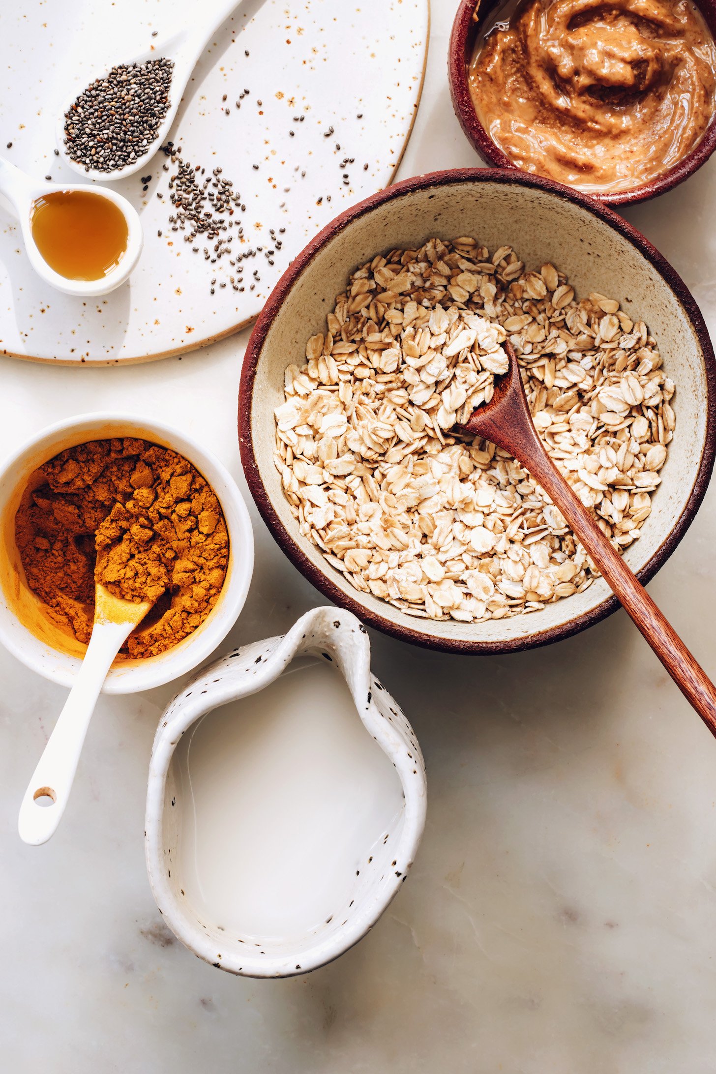 Rolled oats, almond butter, chia seeds, golden milk mix, and coconut milk