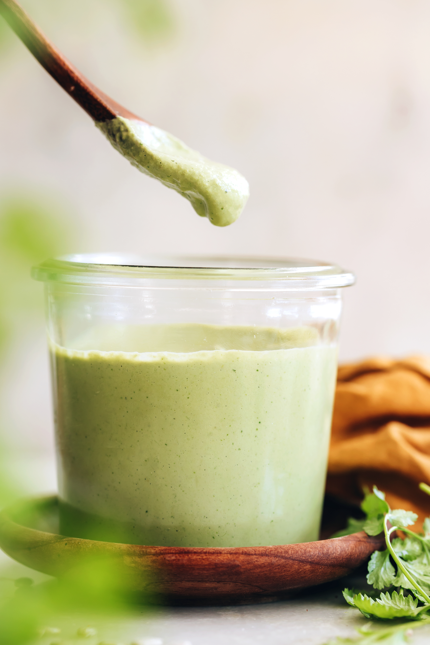 Side view of a jar of cilantro sunflower seed dressing