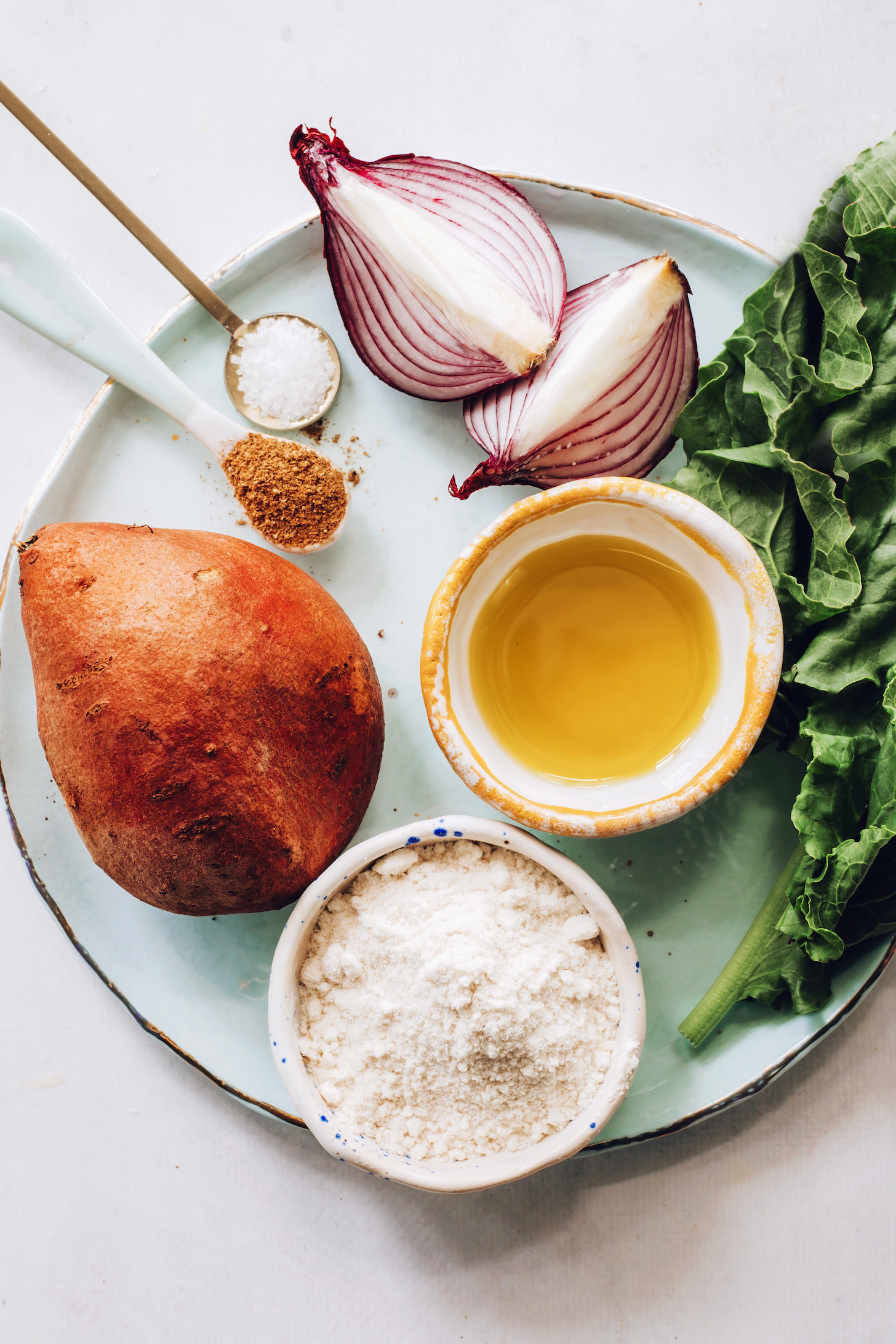 Red onion, kale, avocado oil, rice flour, sweet potato, garam masala, and salt