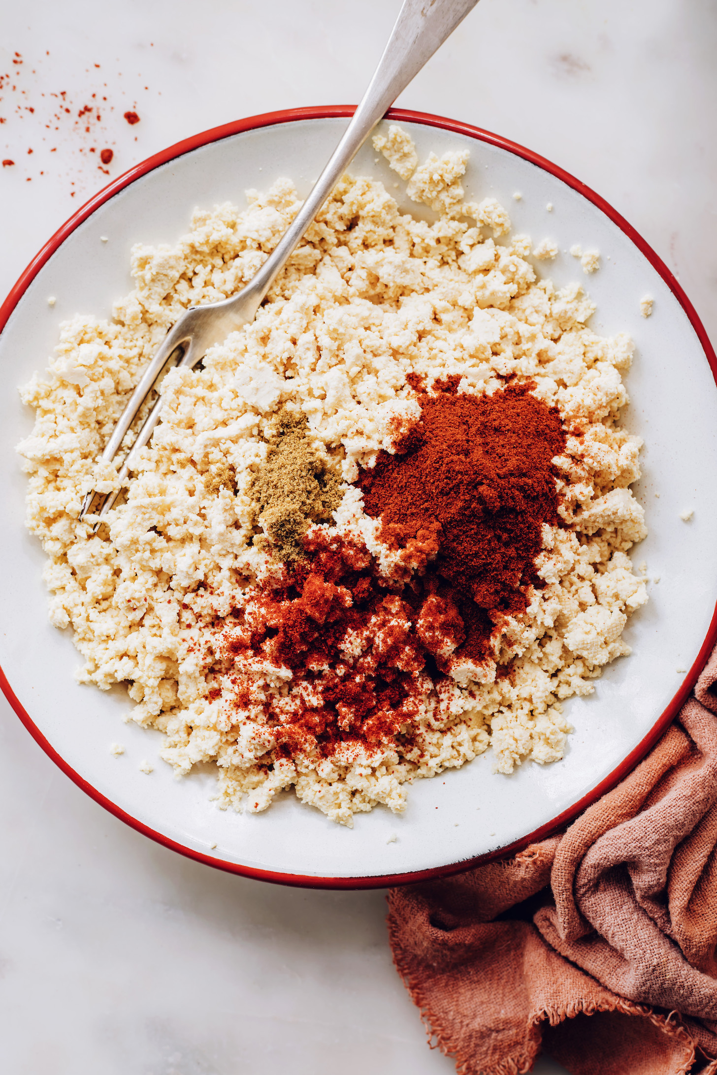 Crumbled tofu topped with cumin, cayenne, and smoked paprika