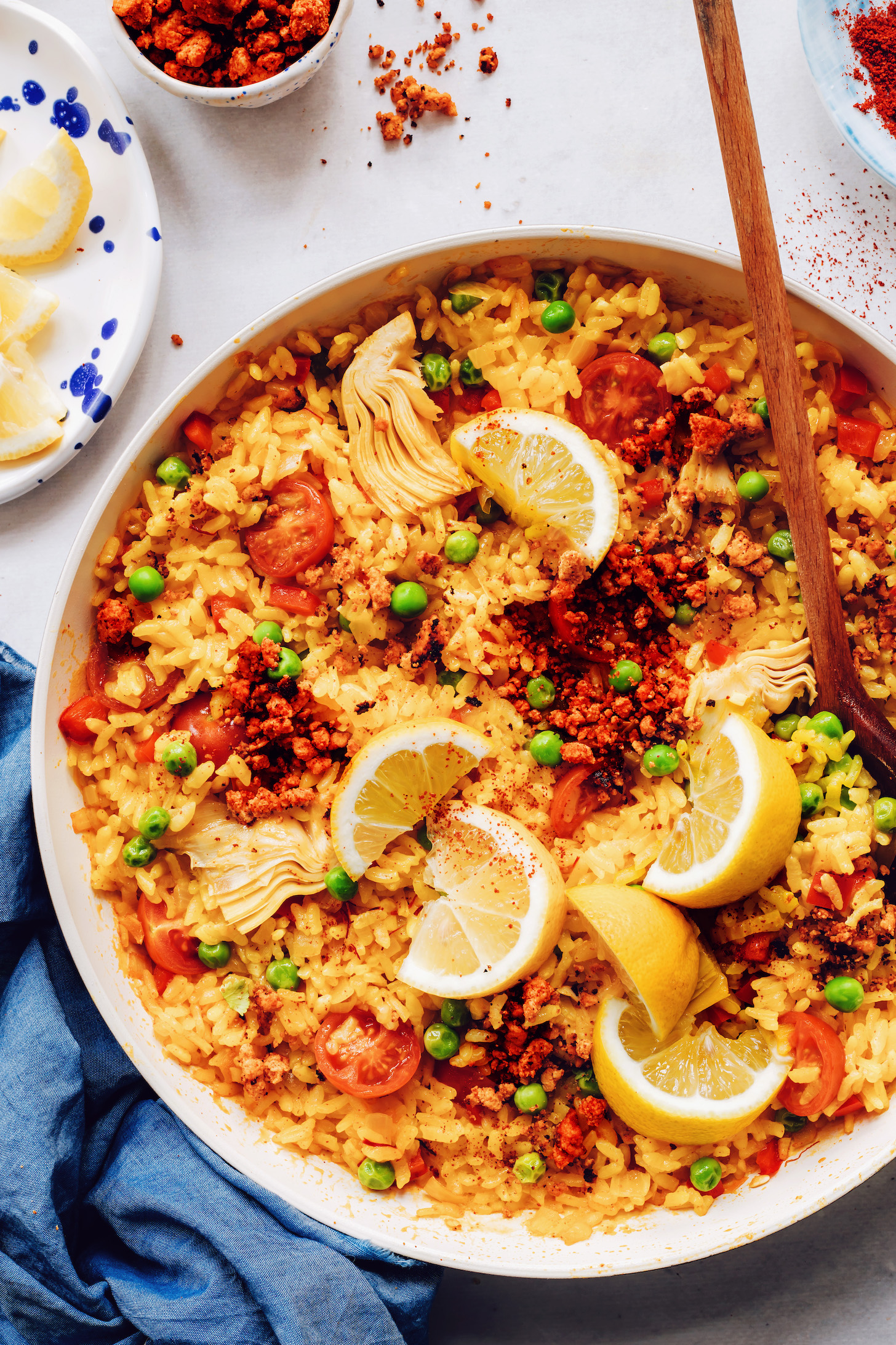 Skillet of our easy vegan paella topped with tofu chorizo sausage