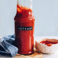 Small bowl and jar of homemade ketchup