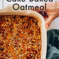 Hands holding a pan of Carrot Cake Baked Oatmeal