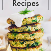 Zucchini quinoa fritters on a plate with fresh dill