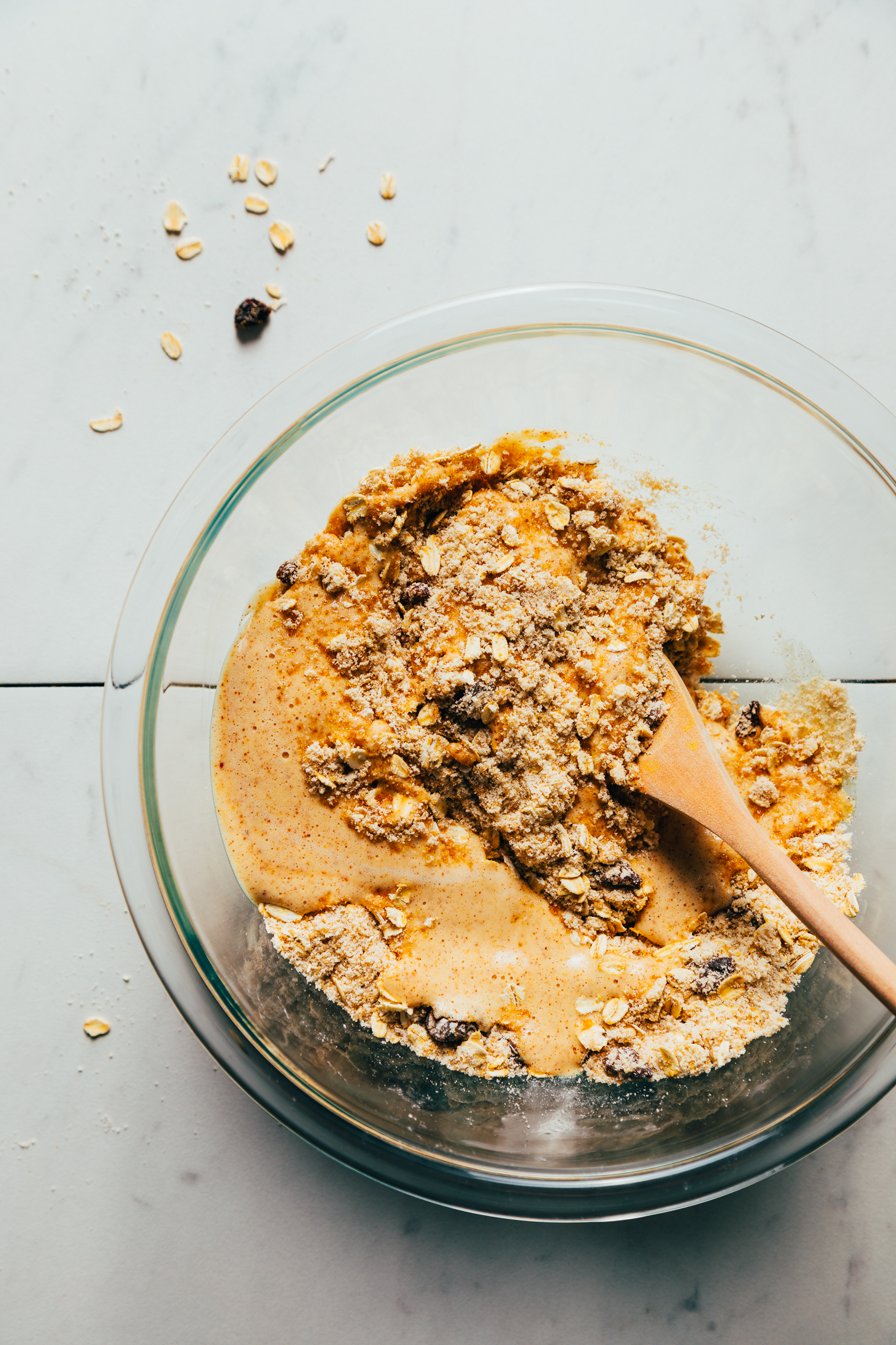 Whipped aquafaba in a bowl over the dry ingredients