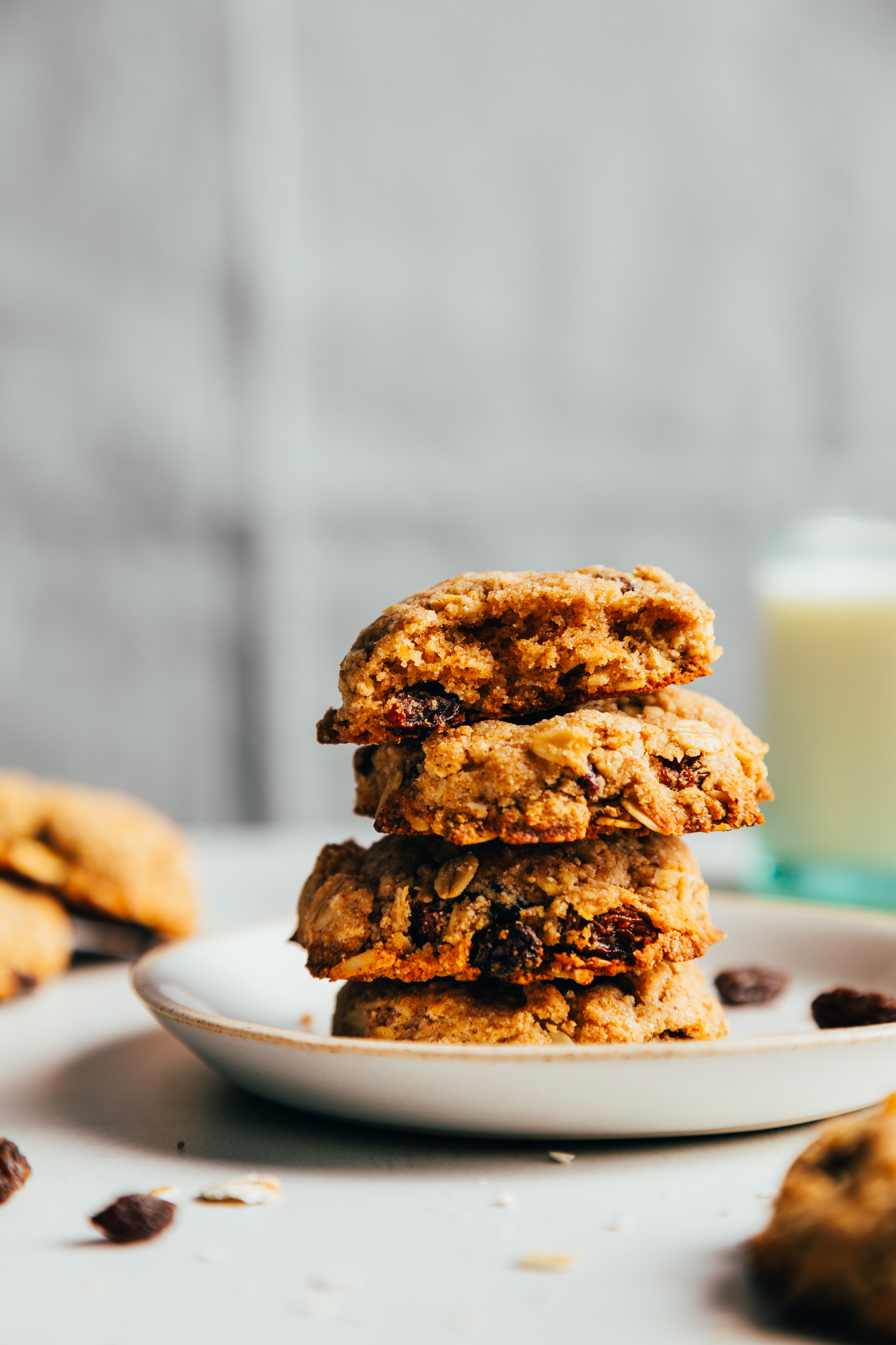 Stack of vegan oatmeal raisin cookies on a plate