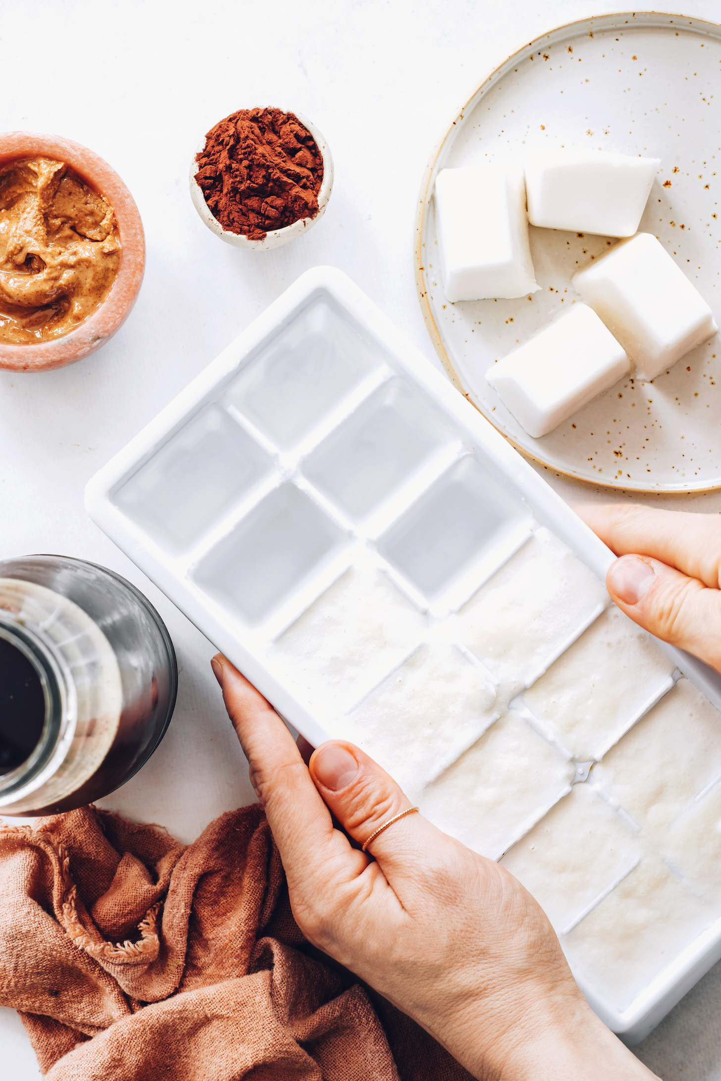 Coconut milk, maple syrup, and vanilla in an ice cube tray