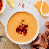 Top down shot of a bowl of creamy harissa sauce