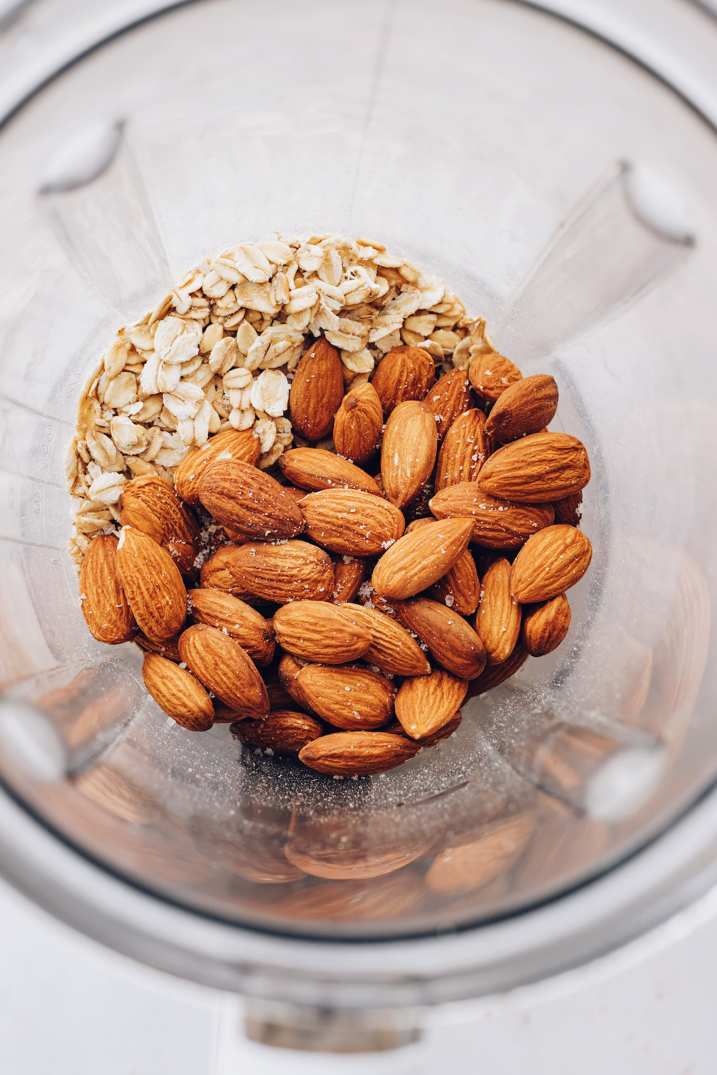 Oats, almonds, and sea salt in a blender