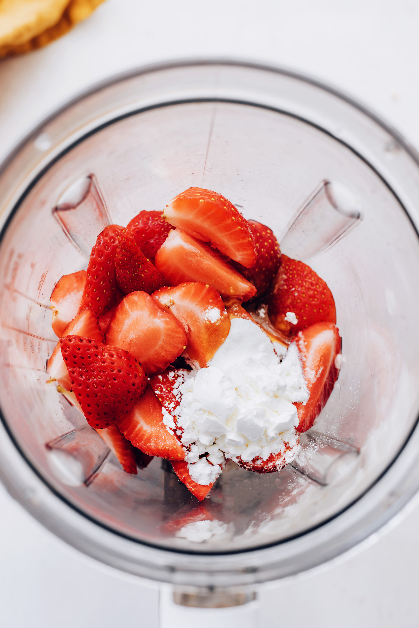 Blender of sliced strawberries and cornstarch
